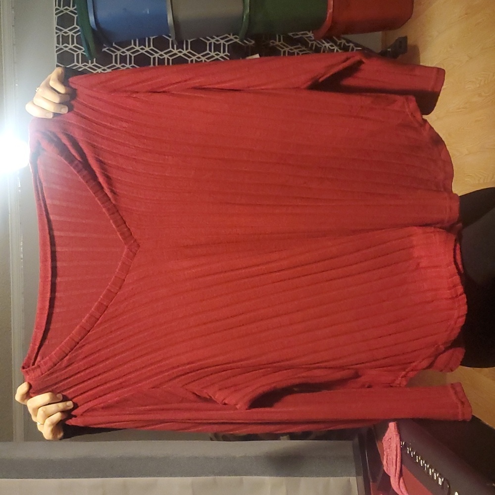 Burgundy sweater.